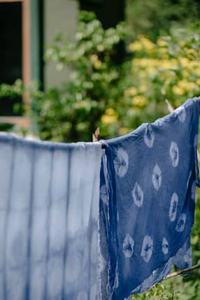 performance fabrics with indigo paint and ornament in garden