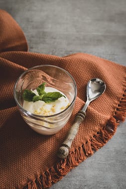 ice cream in clear glass on a textured table linen