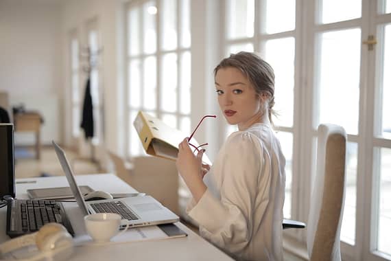 elegant businesswoman with folder in office