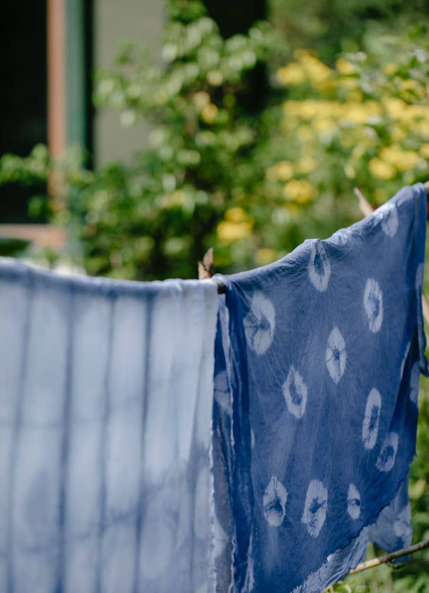 fabrics with indigo paint and ornament in garden