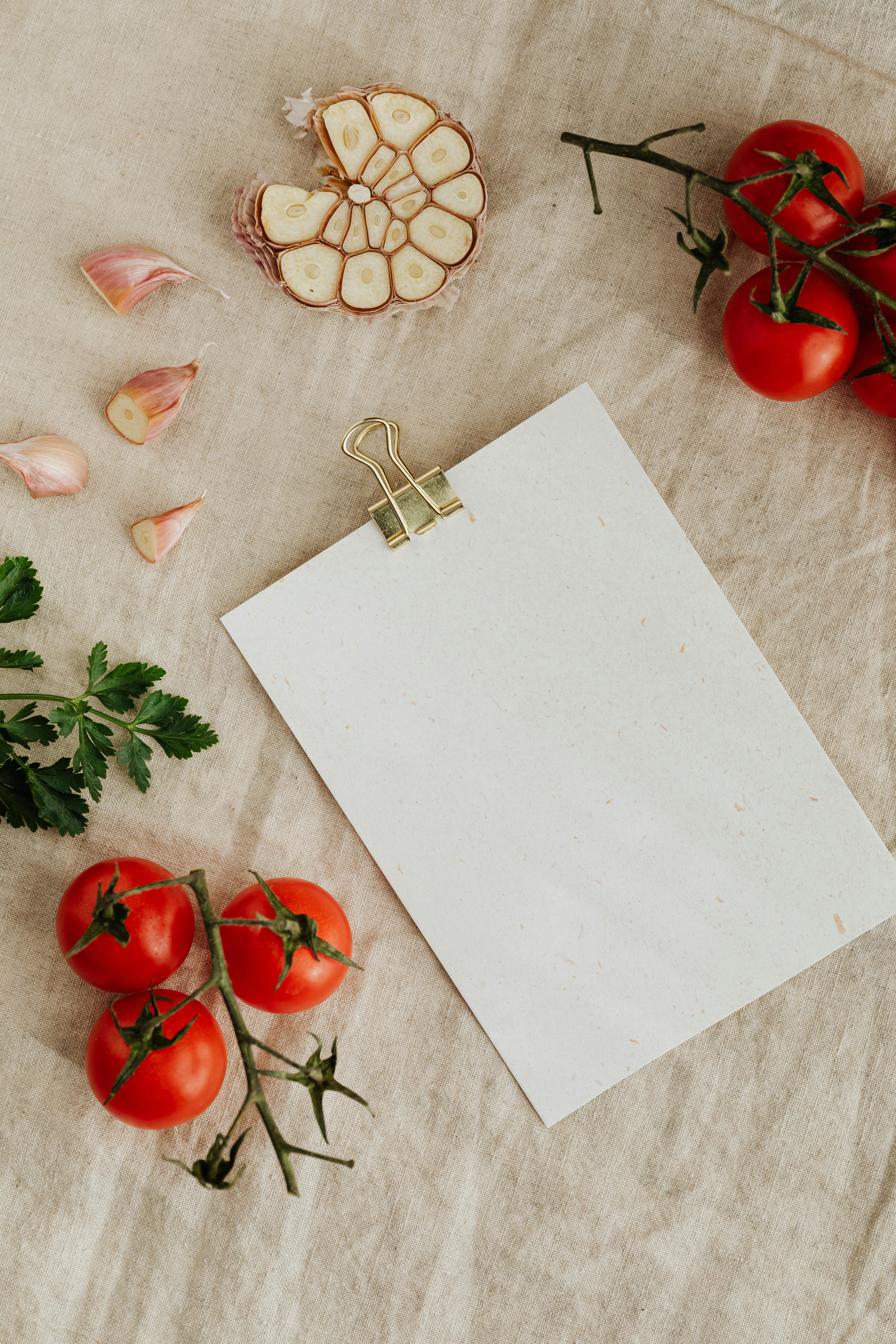 Set of tasty fresh vegetables and herbs with empty clipboard
